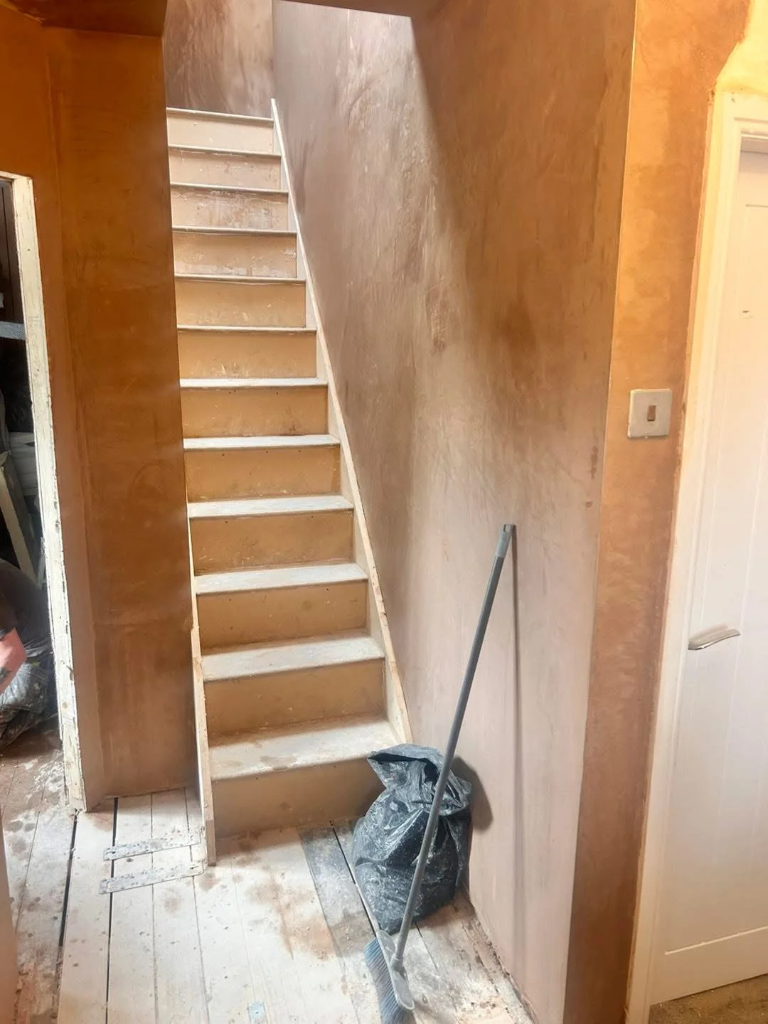 Fresh plasterwork around an internal staircase